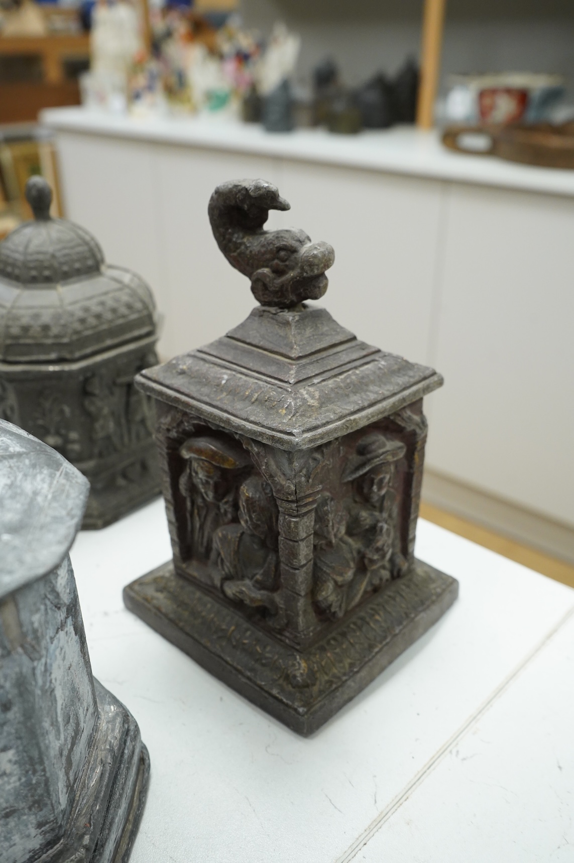 A collection of nine early 19th century lead tobacco boxes and a cover, tallest 20cm